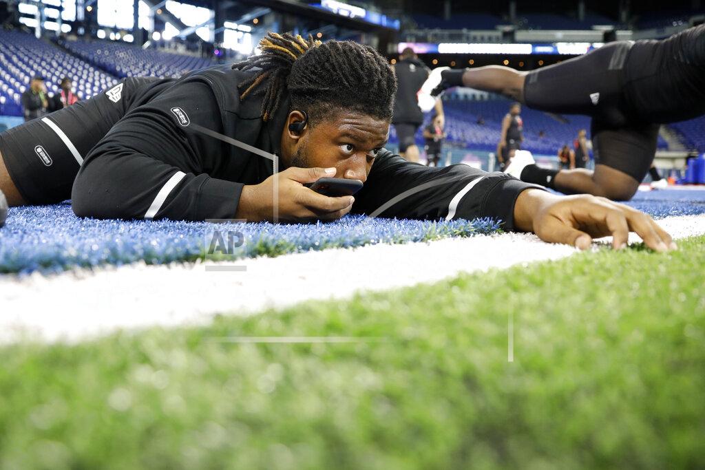 Charlie Neibergall Ohio State defensive lineman Davon Hamilton stretches at the NFL football scouting combine in Indianapolis, Saturday, Feb. 29, 2020. (AP Photo/Charlie Neibergall)