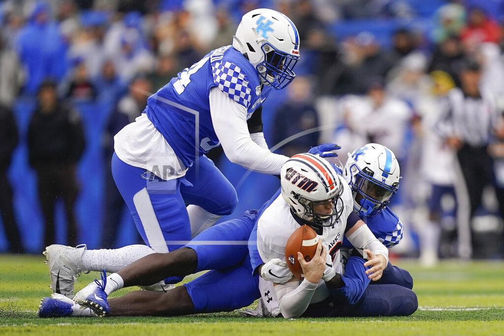 Bryan Woolston Kentucky linebacker Jordan Wright (15) and defensive tackle Abule Abadi-Fitzgerald (94) sack UT Martin quarterback John Bachus III (18) during the first half of an NCAA college football game, Saturday, Nov. 23, 2019, in Lexington, Ky. (AP Photo/Bryan Woolston)