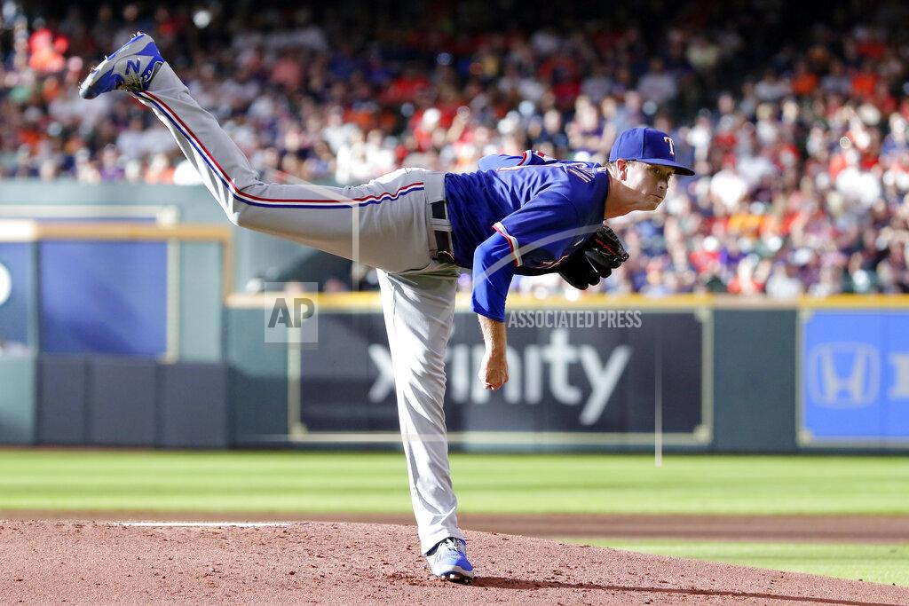 Michael Wyke Texas Rangers starting pitcher Kyle Gibson watches a throw to a Houston Astros batter during the first inning of a baseball game Saturday, July 24, 2021, in Houston. (AP Photo/Michael Wyke)