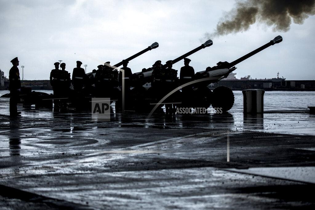 Javier Fergo Royal Gibraltar Regiment fire the Death Gun Salute marking the death of the Duke of Edinburgh in Gibraltar, on Saturday April 10, 2021. Britain's Prince Philip, the irascible and tough-minded husband of Queen Elizabeth II who spent more than seven decades supporting his wife in a role that mostly defined his life, died on Friday. (AP Photo/Javier Fergo)