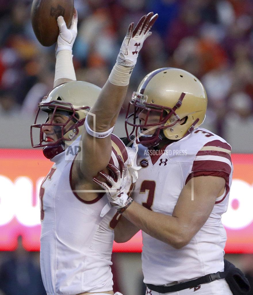 Matt Gentry Korab Idrizi (85) and Michael Walker (3) of Boston College celebrate scoring on 22 yard touchdown play in the second half of an NCAA college football game in Blacksburg Va., Saturday, Nov. 3 2018. Boston College won the game 31-21. (Matt Gentry/The Roanoke Times via AP)