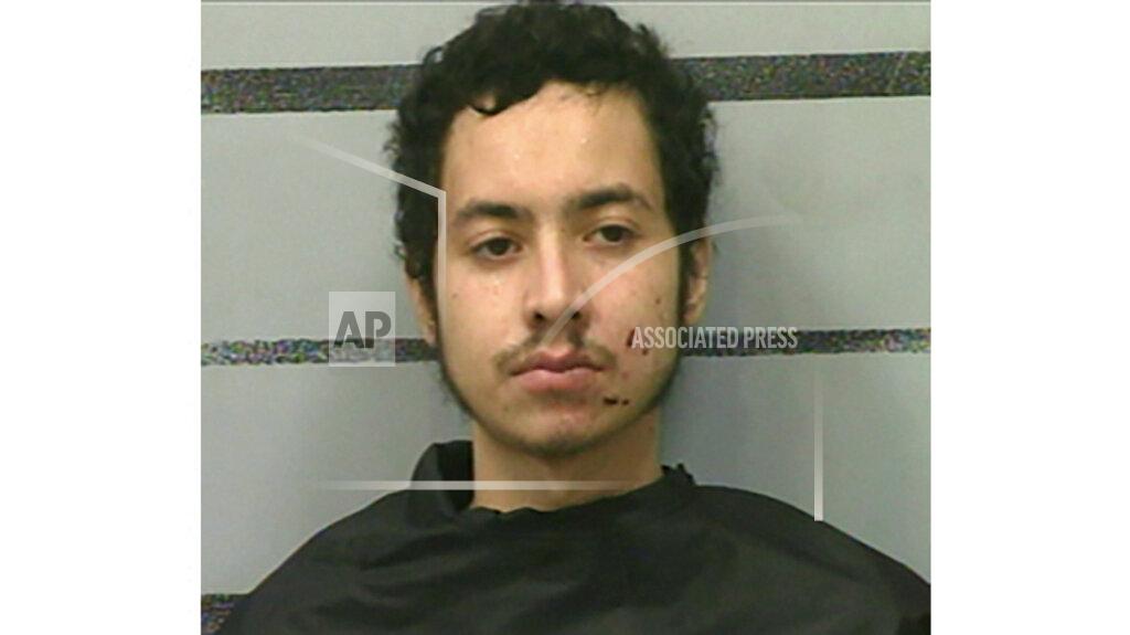 Uncredited This photo provided by the Lubbock County Detention Center show Omar Soto-Chavira. Omar Soto-Chavira, a man charged in the fatal shooting of a SWAT officer in a small West Texas city during a standoff last week was charged Friday, July 23, 2021 with assaulting a federal officer who responded to the scene, prosecutors said. (Lubbock County Detention Center via AP)