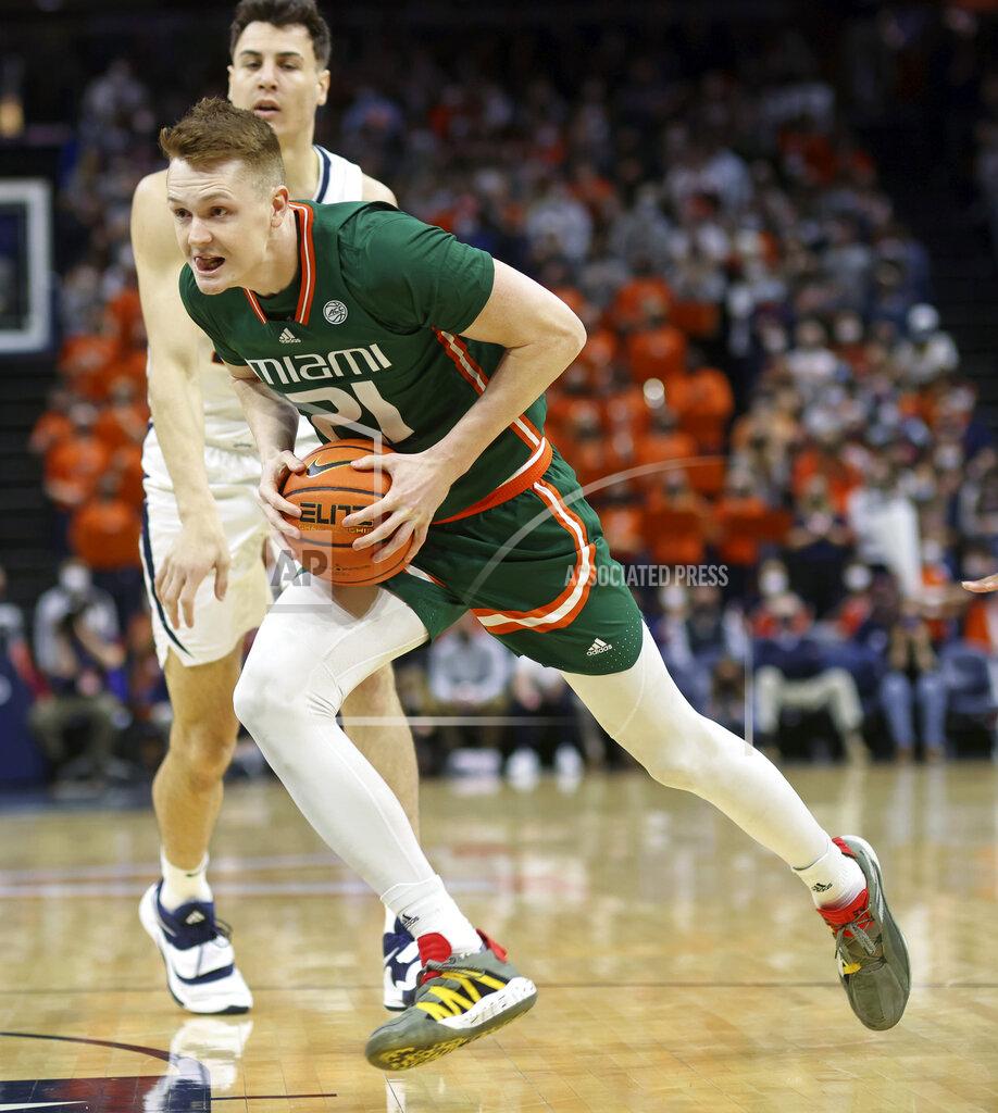 Andrew Shurtleff Miami forward Sam Waardenburg (21) moves past Virginia center Francisco Caffaro (22) during an NCAA college basketball game in Charlottesville, Va., Saturday, Feb. 5, 2022. (AP Photo/Andrew Shurtleff)
