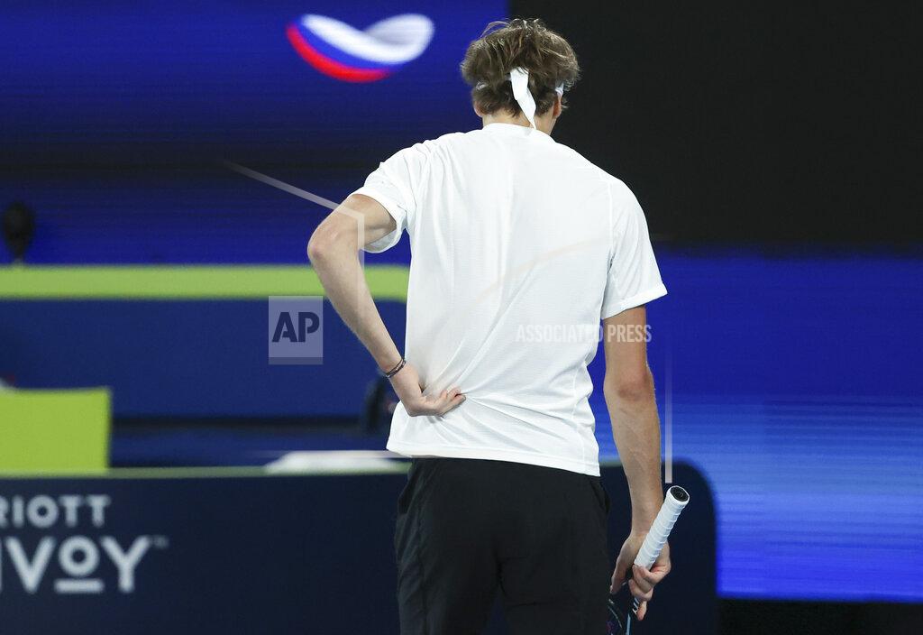 Hamish Blair Germany's Alexander Zverev holds his back during his match against Russia's Daniil Medvedev in their ATP Cup semifinal match in Melbourne, Australia, Saturday, Feb. 6, 2021.(AP Photo/Hamish Blair)