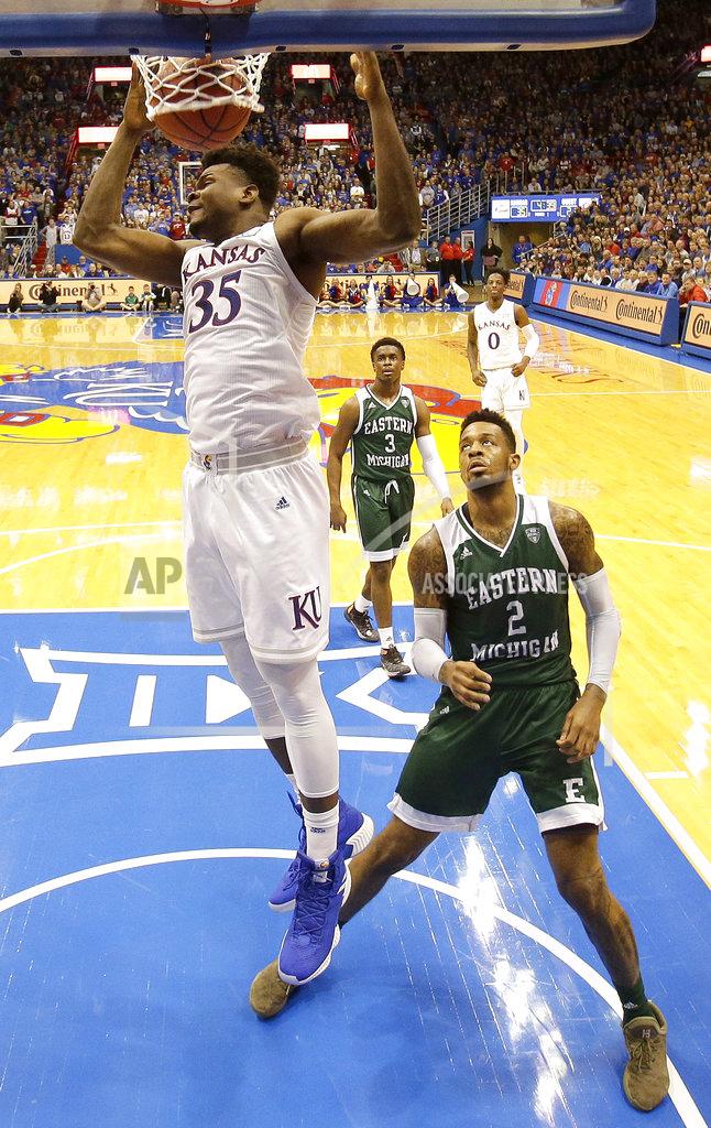 Charlie Riedel Kansas' Udoka Azubuike (35) gets past Eastern Michigan's James Thompson IV (2) to dunk the ball during the first half of an NCAA college basketball game Saturday, Dec. 29, 2018, in Lawrence, Kan. (AP Photo/Charlie Riedel)