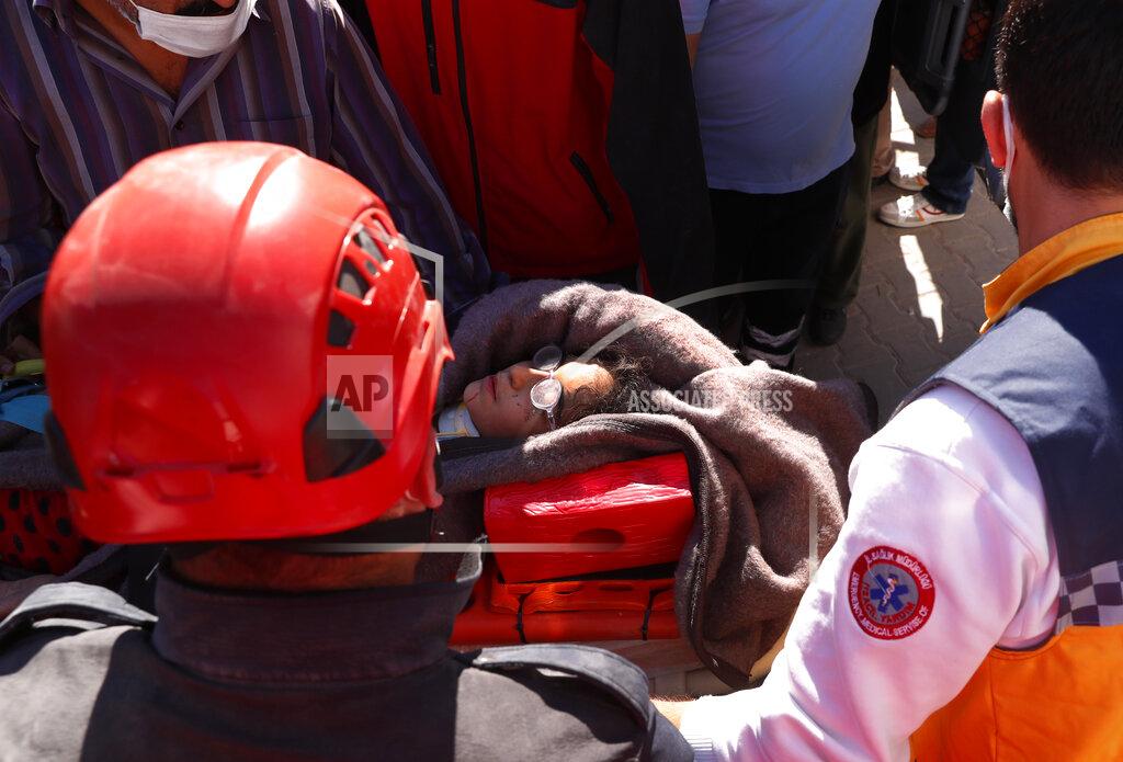 Darko Bandic Medics and rescue personnel carry into an ambulance an injured person from the debris of a collapsed building in Izmir, Turkey, Saturday, Oct. 31, 2020. Rescue teams on Saturday ploughed through concrete blocs and debris of eight collapsed buildings in Turkey's third largest city in search of survivors of a powerful earthquake that struck Turkey's Aegean coast and north of the Greek island of Samos, killing dozens Hundreds of others were injured. (AP Photo/Darko Bandic)