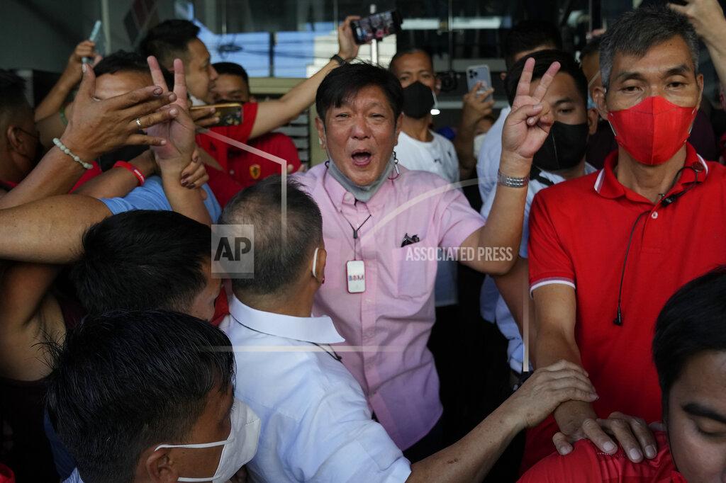 Aaron Favila Presidential candidate Ferdinand "Bongbong" Marcos Jr. celebrates outside his headquarters in Mandaluyong, Philippines on Wednesday, May 11, 2022. Marcos' apparent landslide victory in the Philippine presidential election is raising immediate concerns about a further erosion of democracy in Asia and could complicate American efforts to blunt growing Chinese influence and power in the Pacific. (AP Photo/Aaron Favila)