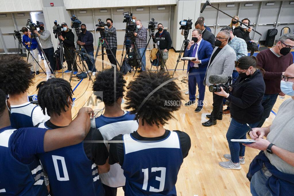 Seth Wenig The St. Peter's University men's basketball team talks to reporters before NCAA college basketball practice in Jersey City, N.J., Tuesday, March 22, 2022. (AP Photo/Seth Wenig)