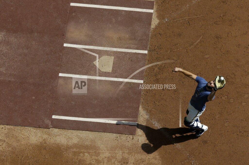 Morry Gash Milwaukee Brewers' David Freitas catches a ball during a practice session Monday, July 13, 2020, at Miller Park in Milwaukee. (AP Photo/Morry Gash)