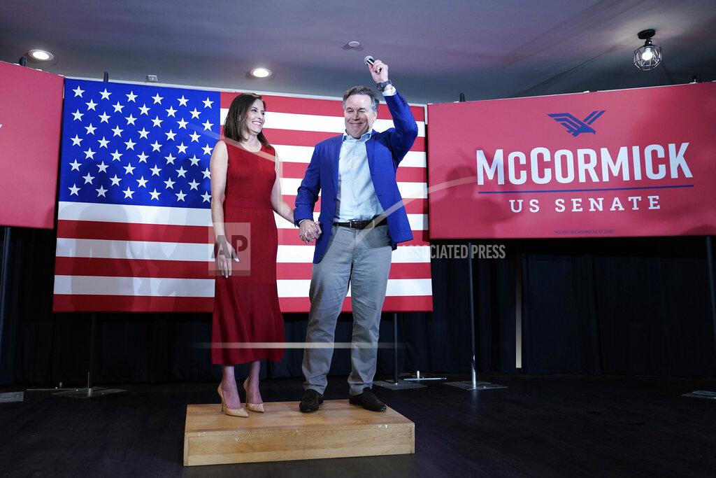 Keith Srakocic Republican candidate for a Pennsylvania U.S. Senate seat, Dave McCormick, right, and his wife Dinah Powell, talk to supporters during his returns watch party in the Pennsylvania primary election, Tuesday, May 17, 2022, in Pittsburgh. (AP Photo/Keith Srakocic)