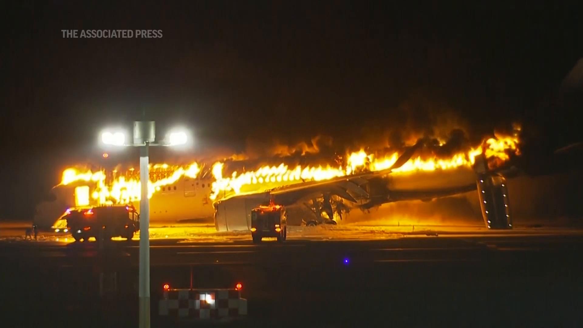 A plane burst into flames on the runway of Tokyo&rsquo;s Haneda airport on Tuesday, with news reports saying it hit another aircraft after landing. NHK TV reported that all passengers aboard, believed to have been about 400 people, got out safely. (Jan. 2)