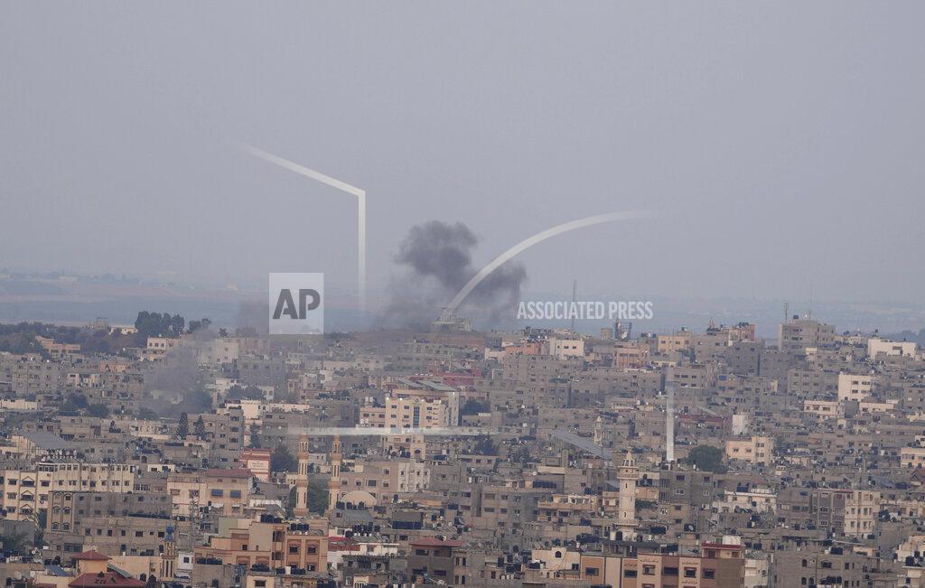 Hatem Moussa Smoke rises following Israeli airstrikes on a building in Gaza City, Friday, Aug. 5, 2022. Palestinian officials say Israeli airstrikes on Gaza have killed several people, including a senior militant, and wounded 40 others. (AP Photo/Hatem Moussa)