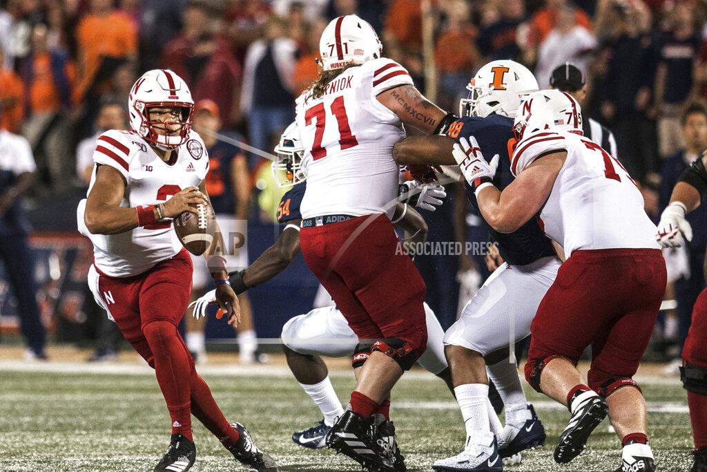 Nebraska quarterback Adrian Martinez (2) looks for an open receiver in the first half of an NCAA college football game against Illinois, Saturday, Sept. 21, 2019, in Champaign, Ill. (AP Photo/Holly Hart)