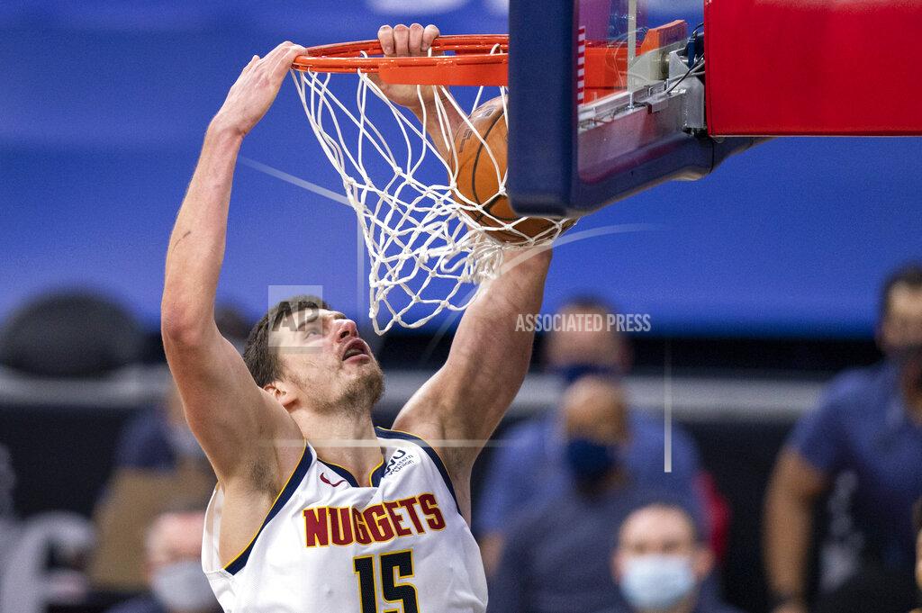 Chris Szagola Denver Nuggets' Nikola Jokic dunks the ball during the first half of an NBA basketball game against the Philadelphia 76ers, Saturday, Jan. 9, 2021, in Philadelphia. (AP Photo/Chris Szagola)