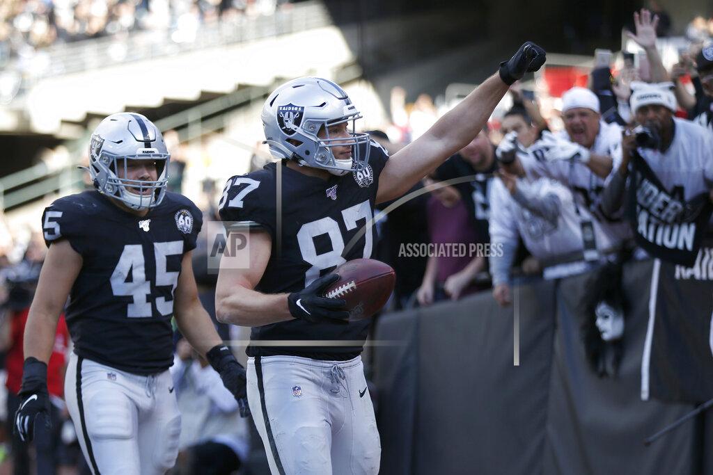 D. Ross Cameron Oakland Raiders tight end Foster Moreau (87) celebrates with running back Alec Ingold (45) after scoring against the Tennessee Titans during the first half of an NFL football game in Oakland, Calif., Sunday, Dec. 8, 2019. (AP Photo/D. Ross Cameron)