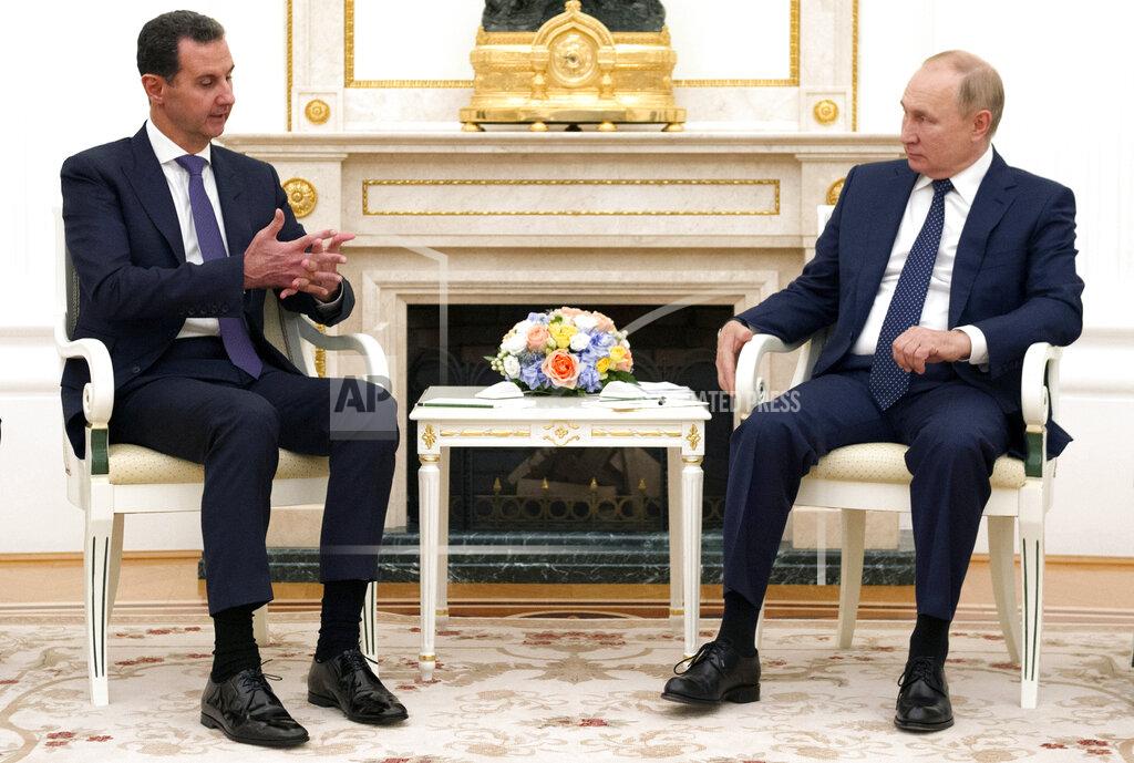 Mikhail Klimentyev Russian President Vladimir Putin, right, sits with Syrian President Bashar Assad during their meeting in the Kremlin in Moscow, Russia, Monday, Sept. 13, 2021. (Mikhail Klimentyev, Sputnik, Kremlin Pool Photo via AP)