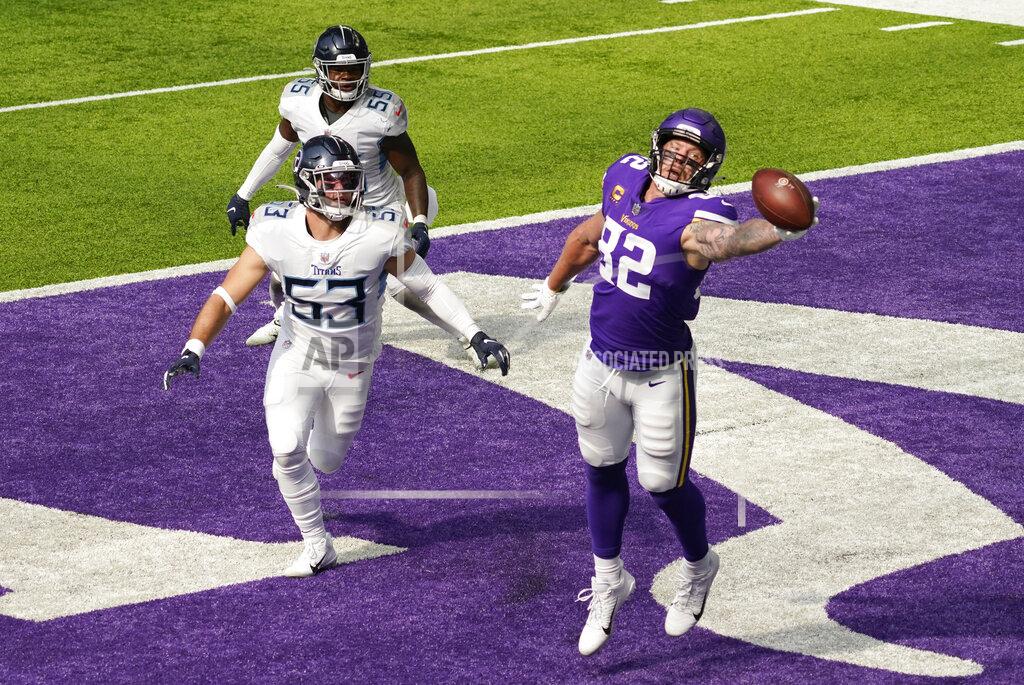 Jim Mone Minnesota Vikings tight end Kyle Rudolph (82) catches a 3-yard touchdown pass ahead of Tennessee Titans inside linebacker Will Compton (53) during the second half of an NFL football game, Sunday, Sept. 27, 2020, in Minneapolis. (AP Photo/Jim Mone)