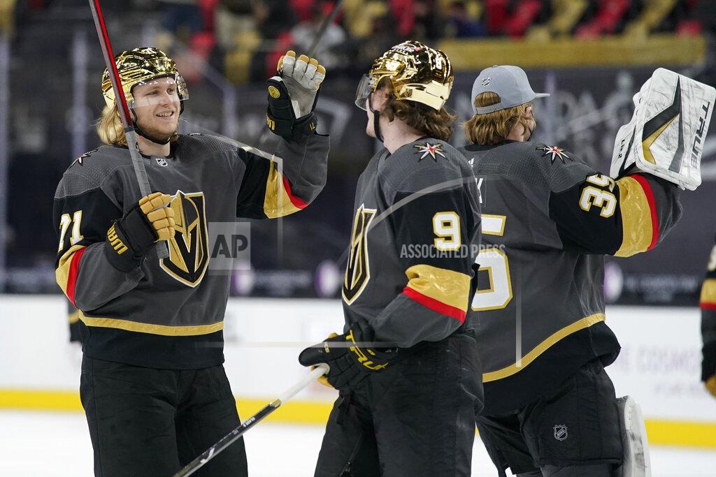 John Locher Vegas Golden Knights center William Karlsson (71) and center Cody Glass (9) celebrate after defeating the Los Angeles Kings in an NHL hockey game Monday, March 29, 2021, in Las Vegas. (AP Photo/John Locher)