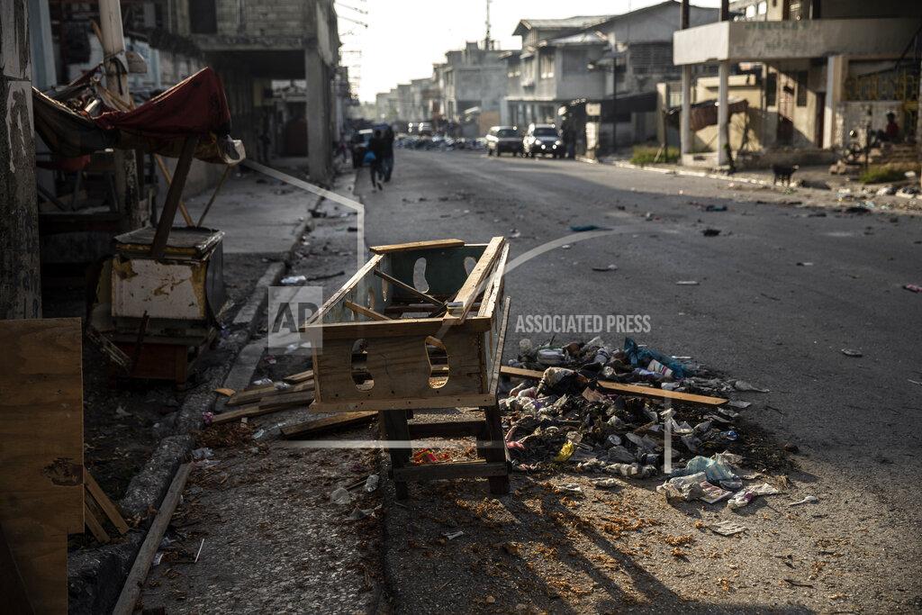 Rodrigo Abd An unfinished coffin sits outside a carpentry shop near an area controlled by gangs in downtown Port-au-Prince, Haiti, Tuesday, Sept. 14, 2021. (AP Photo/Rodrigo Abd)