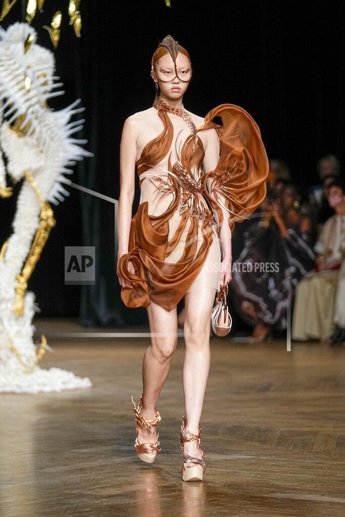 Michel Euler A model wears a creation as part of Iris van Herpen Haute Couture Fall/Winter 2022-2023 fashion collection presented Monday, July 4, 2022 in Paris. (AP Photo/Michel Euler)
