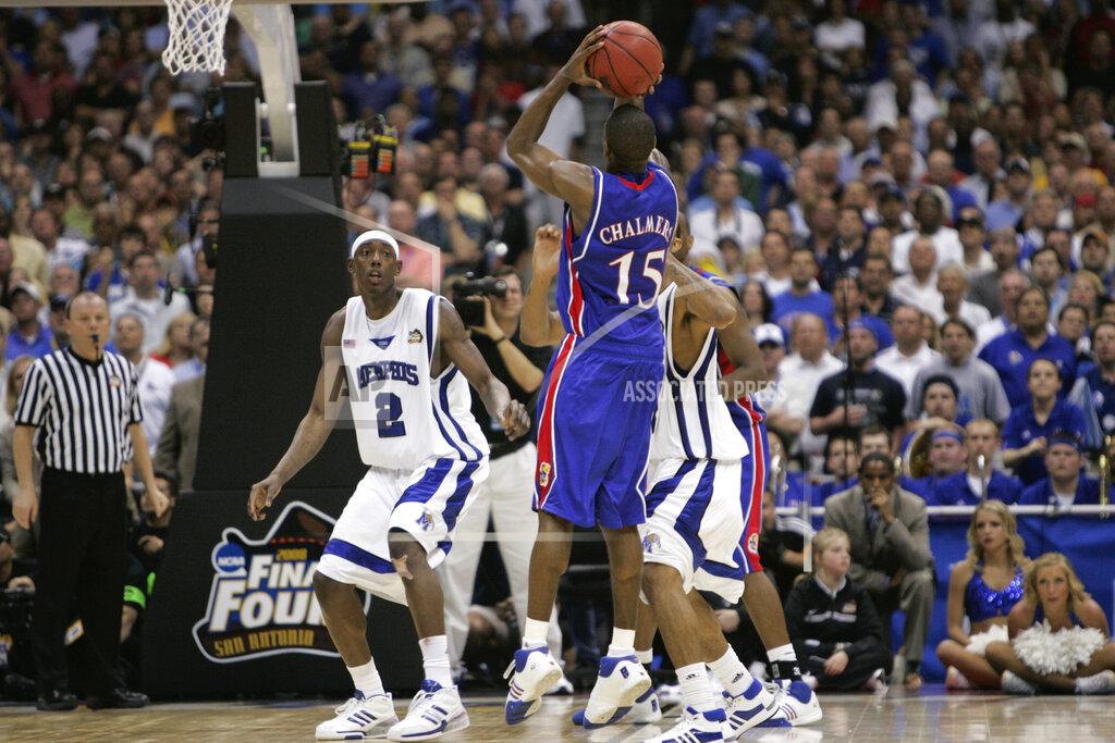 Mark Humphrey FILE - In this Monday, April 7, 2008, file photo, Kansas' Mario Chalmers shoots a three pointer to take the game in to overtime against Memphis during the championship game at the NCAA college basketball Final Four in San Antonio. Kansas defeated Memphis 75-68 in overtime. (AP Photo/Mark Humphrey, File)