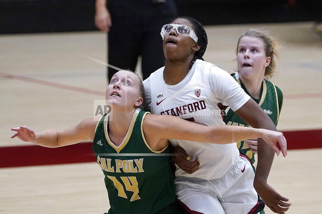 Tony Avelar Stanford forward Francesca Belibi, center, battles for a rebound against Cal Poly forward Hannah Scanlan (14) and Ivana Nikolova during the first half of an NCAA college basketball game in Stanford, Calif., Wednesday, Nov. 25, 2020. (AP Photo/Tony Avelar)