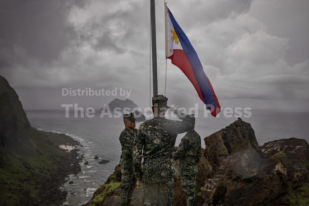 Filipino soldiers take part in a flag raising ceremony on Thursday