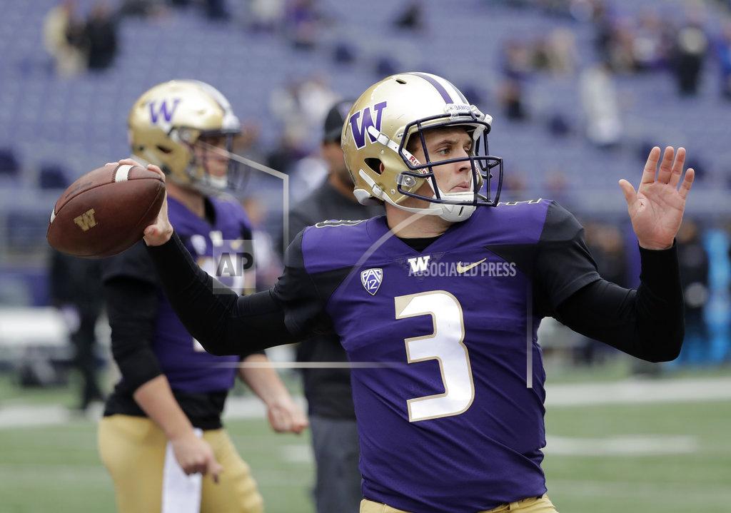 Ted S. Warren Washington quarterback Jake Browning passes during warmups before an NCAA college football game against Colorado, Saturday, Oct. 20, 2018, in Seattle. (AP Photo/Ted S. Warren)