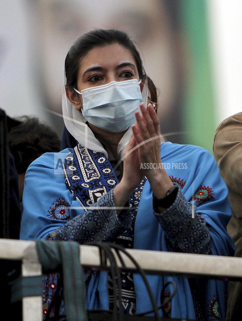 Asim Tanveer Asifa Bhutto Zardari, a leader of the Pakistan Democratic Movement, an alliance of opposition parties, claps during an anti-government rally, in Multan, Pakistan, Monday, Nov. 30, 2020. Despite a government ban and arrests of hundreds of activists, Pakistani opposition supporters rallied in a central city on Monday, calling on Prime Minister Imran Khan to resign over alleged bad governance and incompetence. (AP Photo/Asim Tanveer)