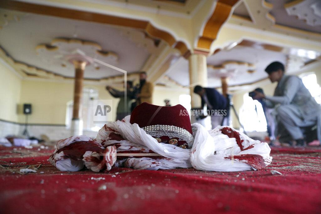 Rahmat Gul A blood-stained turban and cap are seen inside a mosque after a bomb explosion in Shakar Dara district of Kabul, Afghanistan, Friday, May 14, 2021. A bomb ripped through a mosque in northern Kabul during Friday prayers killing 12 worshippers, Afghan police said. (AP Photo/Rahmat Gul)