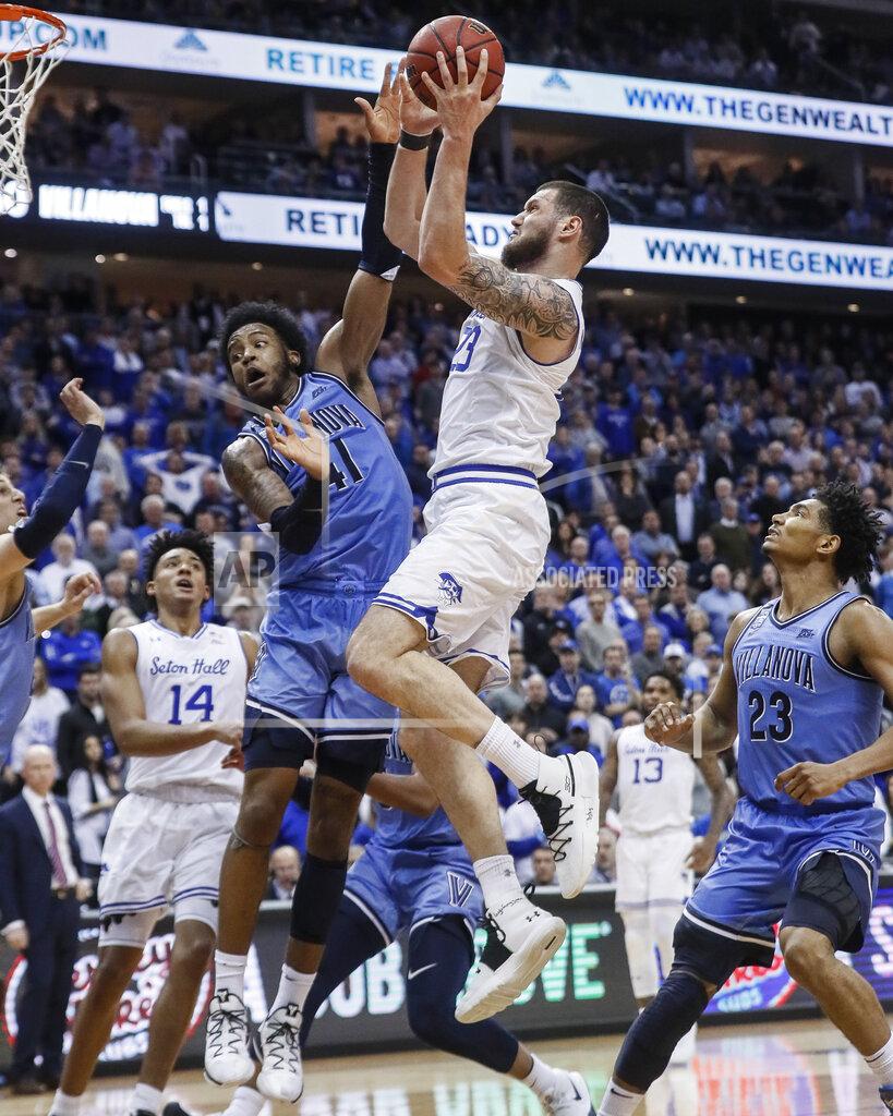John Minchillo Seton Hall's Sandro Mamukelashvili (23) shoots against Villanova's Saddiq Bey (41) during the second half of an NCAA college basketball game Wednesday, March 4, 2020, in Newark, N.J. (AP Photo/John Minchillo)