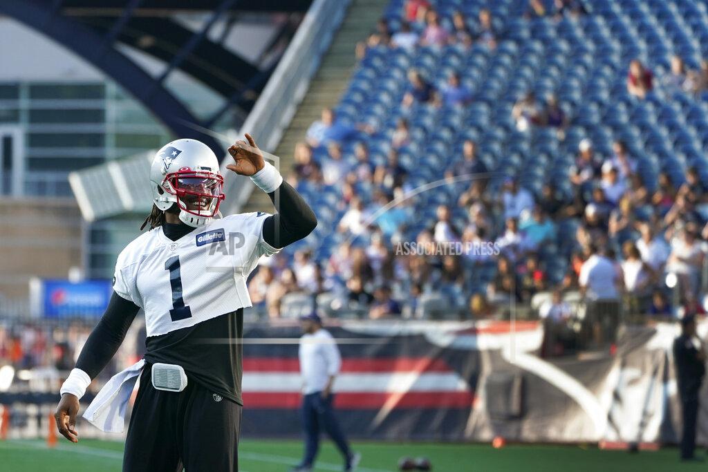 Elise Amendola New England Patriots quarterback Cam Newton (1) waves to fans in attendance at Gillette Stadium during the NFL football team's practice Friday, Aug. 6, 2021, in Foxborough, Mass. (AP Photo/Elise Amendola)
