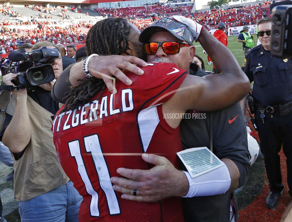 Mark Lomoglio Arizona Cardinals wide receiver Larry Fitzgerald (11) hugs Tampa Bay Buccaneers head coach Bruce Arians after an NFL football game Sunday, Nov. 10, 2019, in Tampa, Fla. Arians is a former Cardinals head coach. (AP Photo/Mark LoMoglio)