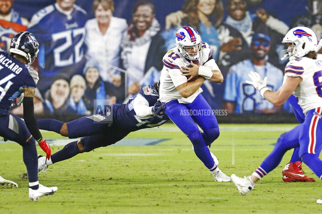 Wade Payne Buffalo Bills quarterback Josh Allen (17) scrambles as Tennessee Titans defensive end Vic Beasley (44) tries to bring him down in the second half of an NFL football game Tuesday, Oct. 13, 2020, in Nashville, Tenn. (AP Photo/Wade Payne)