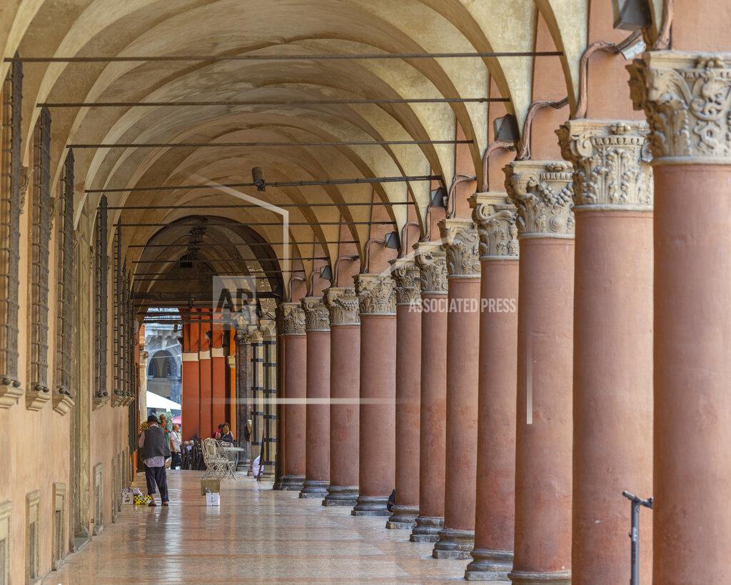 Guido Calamosca A view of Bologna's porticoes in Bologna, Italy, Wednesday, July 28, 2021. Bologna's 12th-century porticoes, still part of the city's everyday life, have been added to the World Heritage List. At a meeting in China on Wednesday, the World Heritage Committee of UNESCO, the U.N. culture agency, inscribed the porticoes on the prestigious list. The addition raises to 58 the number of Italian sites on the list. (Guido Calamosca/LaPresse via AP)