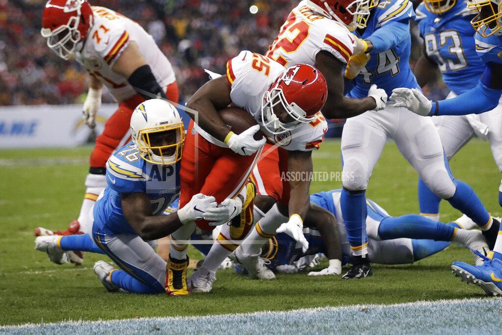 Marcio Jose Sanchez Kansas City Chiefs running back LeSean McCoy, center, scores a touchdown during the first half of an NFL football game against the Los Angeles Chargers, Monday, Nov. 18, 2019, in Mexico City. (AP Photo/Marcio Jose Sanchez)