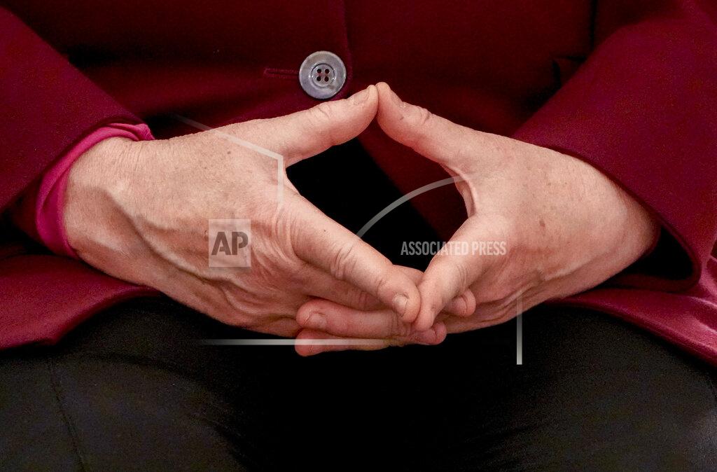 Markus Schreiber German Chancellor Angela Merkel forms her hands before receiving her certificate of dismissal in Berlin, Tuesday, Oct. 26, 2021. Merkel stays in office until a successor is elected. (Photo/Markus Schreiber)