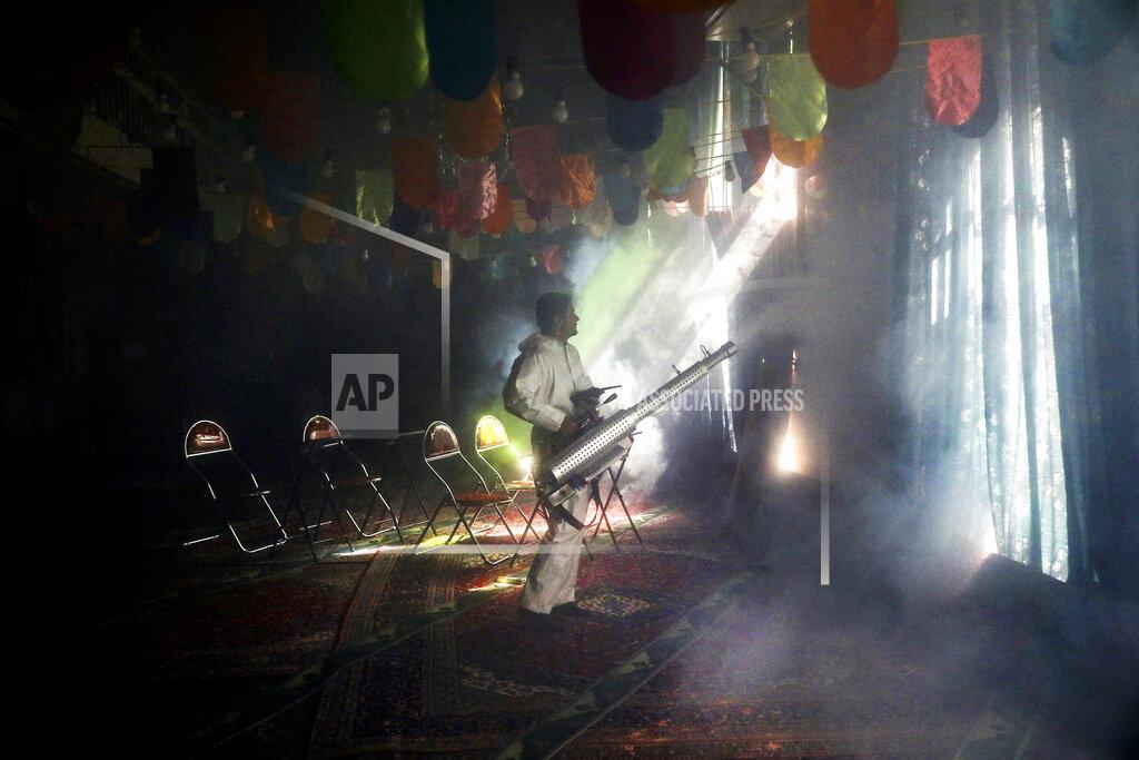 Ebrahim Noroozi A firefighter disinfects a mosque to help prevent the spread of the new coronavirus in northern Tehran, Iran, Friday, March, 6, 2020. A Health Ministry spokesman warned authorities could use unspecified "force" to halt travel between major cities. (AP Photo/Ebrahim Noroozi)