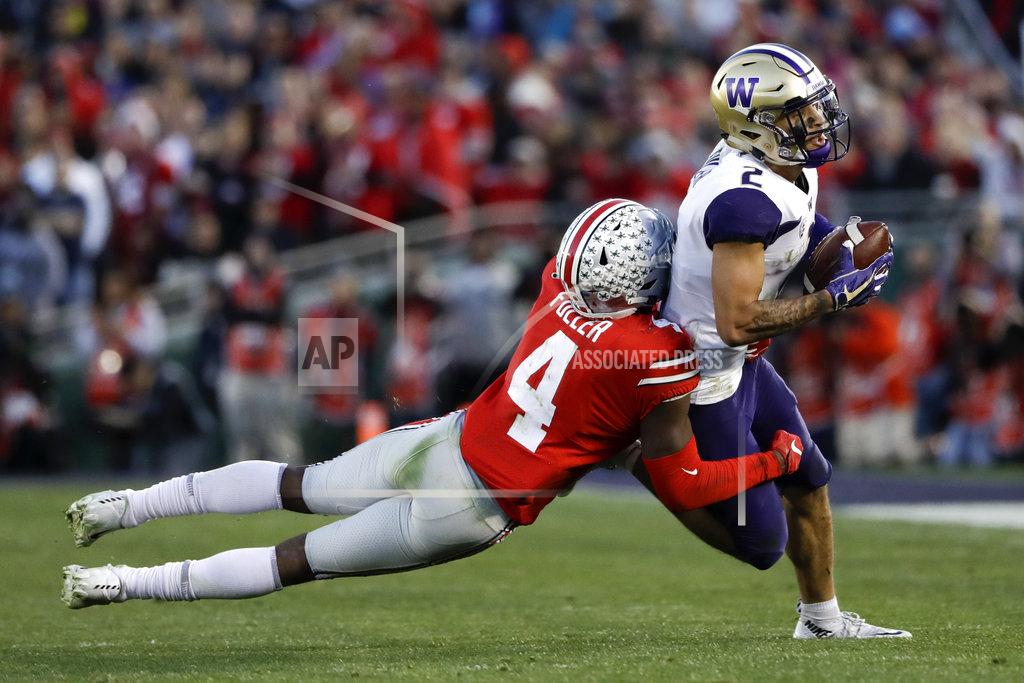 Marcio Jose Sanchez Washington wide receiver Aaron Fuller is tackled by Ohio State safety Jordan Fuller during the second half of the Rose Bowl NCAA college football game Tuesday, Jan. 1, 2019, in Pasadena, Calif. (AP Photo/Marcio Jose Sanchez)