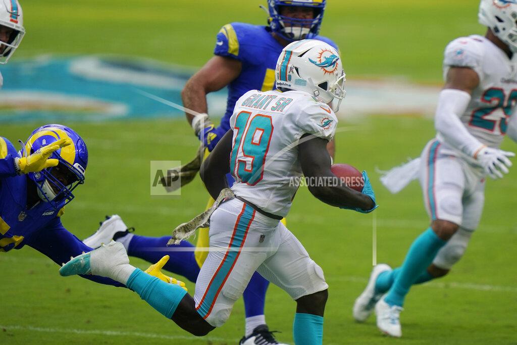 Lynne Sladky Miami Dolphins wide receiver Jakeem Grant (19) runs for a punt return touchdown during the first half of an NFL football game against the Los Angeles Rams, Sunday, Nov. 1, 2020, in Miami Gardens, Fla. (AP Photo/Lynne Sladky)
