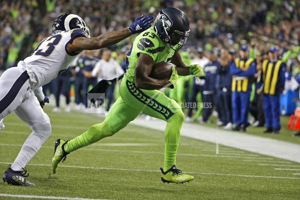 Elaine Thompson Seattle Seahawks wide receiver David Moore, right, gets past Los Angeles Rams strong safety John Johnson to score a touchdown during the second half of an NFL football game Thursday, Oct. 3, 2019, in Seattle. (AP Photo/Elaine Thompson)