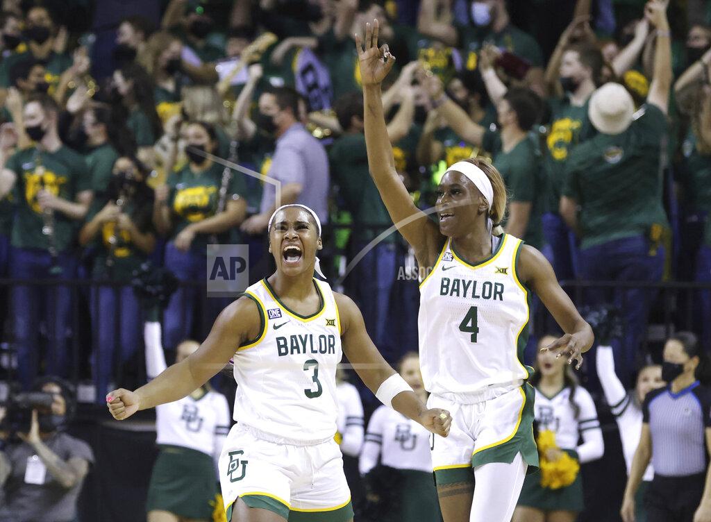 Rod Aydelotte Baylor guard Jordan Lewis, left, reacts to her three point shot with teammate Queen Egbo, right, in the first half of an NCAA college basketball game against Iowa State, Sunday, Jan. 23, 2022, in Waco, Texas. (Rod Aydelotte/Waco Tribune-Herald via AP)