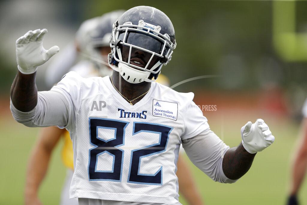 Mark Humphrey FILE - In this May 30, 2019, file photo, Tennessee Titans tight end Delanie Walker warms up during an organized team activity at the Titans' NFL football training facility, in Nashville, Tenn. Walker is a week from his 35th birthday, and the Titans' three-time Pro Bowl tight end is heading into his 14th NFL season. He also believes he's in better shape than some 21-year-olds coming into the league. (AP Photo/Mark Humphrey, File)