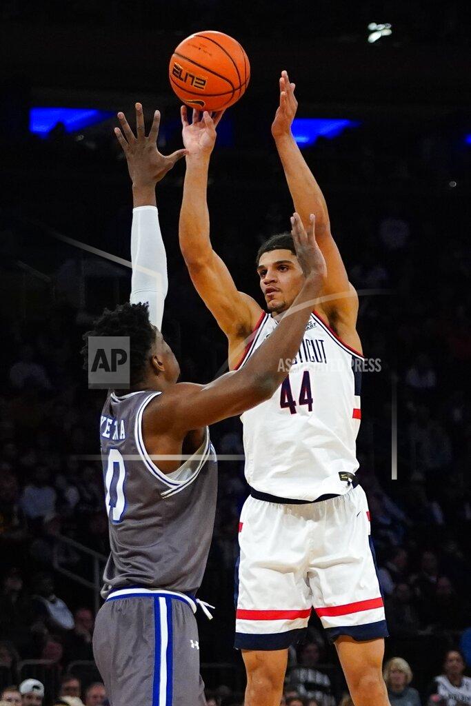 Frank Franklin Ii Connecticut's Andre Jackson (44) shoots over Seton Hall's Alexis Yetna (10) during the first half of an NCAA college basketball game at the Big East conference tournament Thursday, March 10, 2022, in New York. (AP Photo/Frank Franklin II)