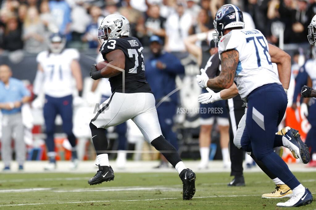 D. Ross Cameron Oakland Raiders defensive tackle Maurice Hurst (73) runs after intercepting a pass against the Tennessee Titans during the first half of an NFL football game in Oakland, Calif., Sunday, Dec. 8, 2019. (AP Photo/D. Ross Cameron)