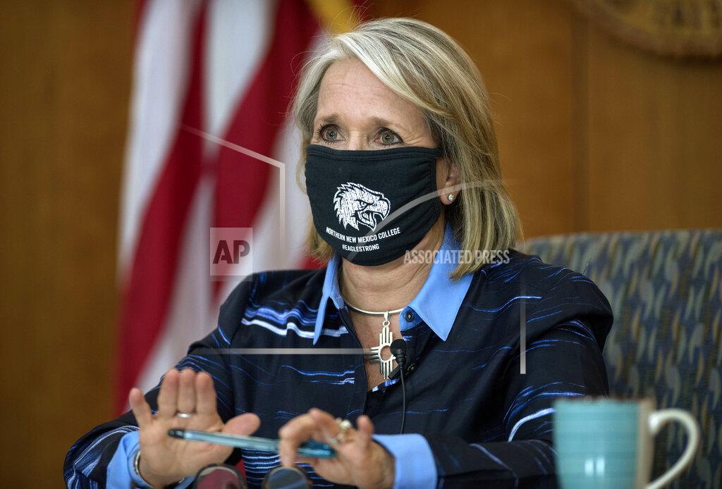 Eddie Moore FILE - In this July 23, 2020, file photo, Gov. Michelle Lujan Grisham gives her weekly update on COVID-19 and the state's effort to contain it during a virtual news conference from the state Capitol in Santa Fe, N.M. With an influx of federal COVID-19 relief money coming on top of surprisingly strong revenue pictures, governors suddenly have a way to pay for big, expensive undertakings that have long languished on their to-do lists. “There are no words to describe the impact that has on a state that has long had extreme and persistent poverty,” said Grisham, a Democrat, said Wednesday, March 10, 2021. (Eddie Moore/The Albuquerque Journal via AP)