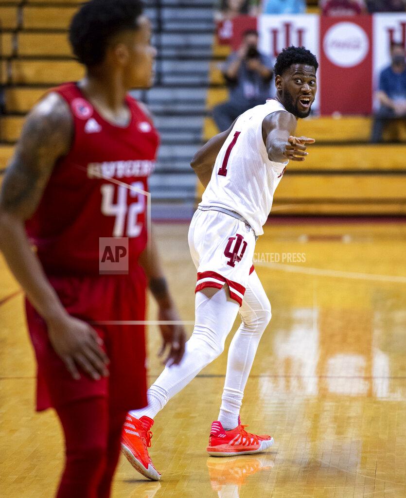 Doug Mcschooler Indiana guard Al Durham (1) reacts towards Rutgers guard Jacob Young (42) after Young failed to block Durham's 3-point shot during the second half of an NCAA college basketball game, Sunday, Jan. 24, 2021, in Bloomington, Ind. (AP Photo/Doug McSchooler)