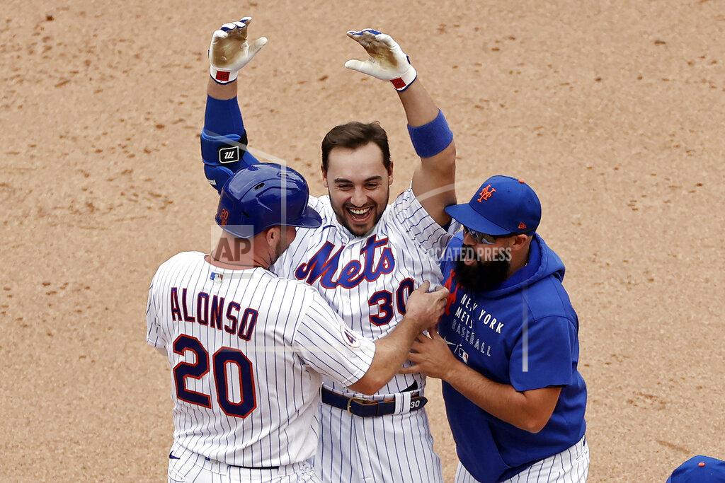 Adam Hunger New York Mets' Michael Conforto celebrates his walk-off single with Pete Alonso and Luis Guillorme against the Miami Marlins during the ninth inning of the first game of a baseball doubleheader that started April 11 and was suspended because of rain, Tuesday, Aug. 31, 2021, in New York. The Mets won 6-5. (AP Photo/Adam Hunger)