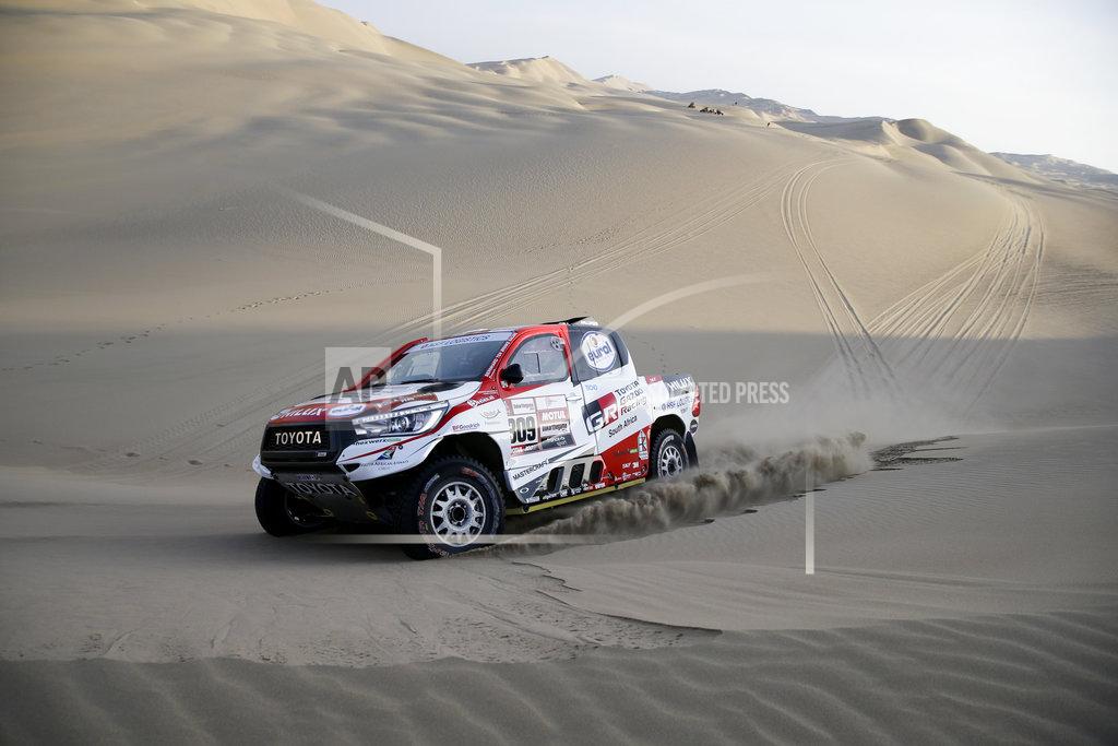 Ricardo Mazalan Driver Bernhard Ten Brinke, of Netherlands, and co-driver Xavier Panseri, of France, race their Toyota during the second stage of the Dakar Rally between Pisco and San Juan de Marcona, Peru, Tuesday, Jan. 8, 2019. (AP Photo/Ricardo Mazalan)