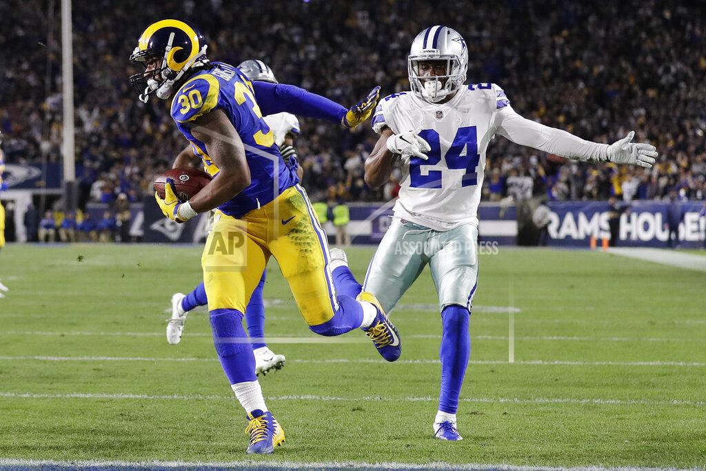 Marcio Jose Sanchez Los Angeles Rams running back Todd Gurley scores past Dallas Cowboys cornerback Chidobe Awuzie during the first half in an NFL divisional football playoff game Saturday, Jan. 12, 2019, in Los Angeles. (AP Photo/Marcio Jose Sanchez)